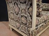 a couch that is sitting on a carpeted floor