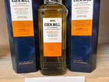 three bottles of eden mill on a shelf in a store