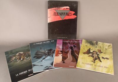 quatre livres sont posés sur la table et un autre est posé sur la table