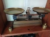 a scale that is sitting on a shelf in a room