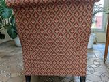 a chair that is sitting in the middle of a room