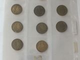 a lot of coins that are in a plastic bag