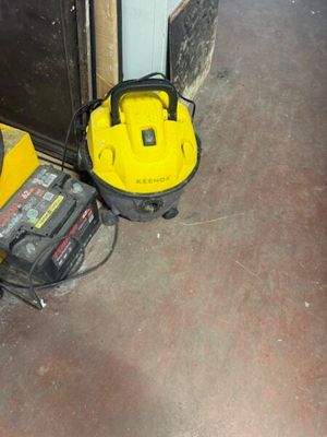 two tools that are sitting on the floor next to each other