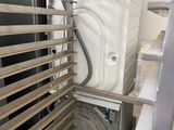 a washer and dryer inside of a metal cage