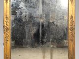 a large mirror that has a reflection of a person in it