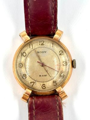 an image of a close up of a wrist watch on a white surface
