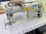 a sewing machine that is sitting on a table