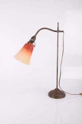 an image of a desk lamp with a red shade on it