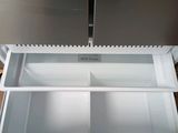 an image of a stainless steel refrigerator with its door open