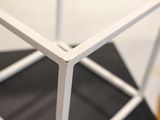 a close up of a metal structure on a table