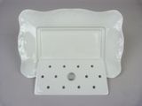 a white plate with a tray attached to it