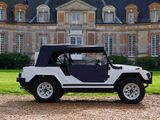 a white and black jeep parked in front of a large building