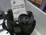 a bag with a camera and a camera lens in it