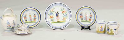 five plates and two cups and a pitcher on a table