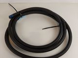 a close up of a black hose on a white surface