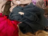 a pile of clothes that is sitting on a table