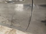 a close up of a car door handle with a sticker on it