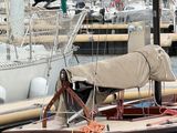 many sailboats docked in the harbor of a marina