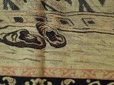 a close up of a rug with a pair of shoes on it