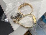 a pair of scissors sitting on a table next to a laptop