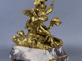 an image of a statue of a woman on a marble base