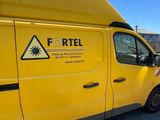 a yellow van that is parked in the parking lot