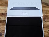 the box is open on a wooden table with a laptop in it