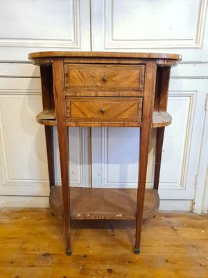 a small wooden table with a drawer on top of it