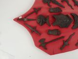 a red shield with a lot of different items on it