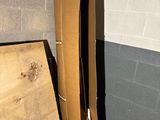a pile of cardboard sitting in the corner of a room