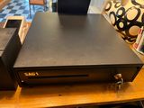 a dvd player sitting on top of a wooden table