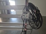 a power strip attached to a pole in a room