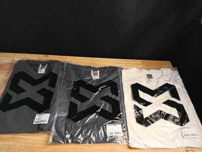 three t - shirts with black and white logos are sitting on a table