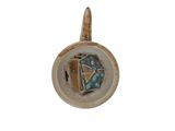 a picture of a ceramic object with a diamond on it