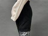 an image of a mannequin mannequin wearing a black and white dress