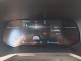 the dashboard of a car with a digital display on it