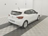 the rear end of a white car parked in a garage