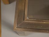 a close up of a table with a mirror on it