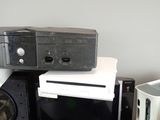 a lot of electronics on top of each other on a table
