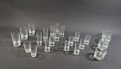 several shot glasses are lined up in a circle on a table