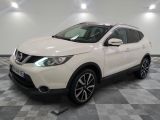 the white nissan qx sport suv is parked in the garage
