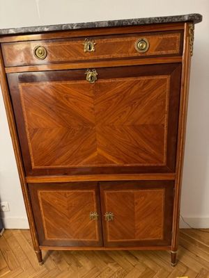 an image of a wooden cabinet with a marble top