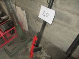 a picture of a number sign on a pole in a basement