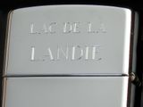 a silver lighter with the word la mode la landie written on it