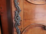 a close up of a wooden door with a metal handle