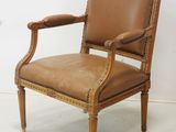 an image of a brown leather chair sitting on top of a white floor