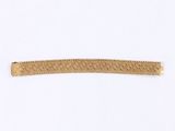 a close up of a gold hair clip on a white background