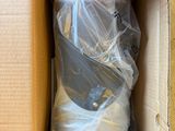 a cardboard box with a plastic bag inside of it