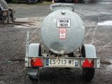 a trailer with a tank attached to the back of it