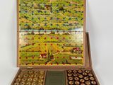 une boîte en bois remplie d'un assortiment de chocolats, posée sur une surface blanche